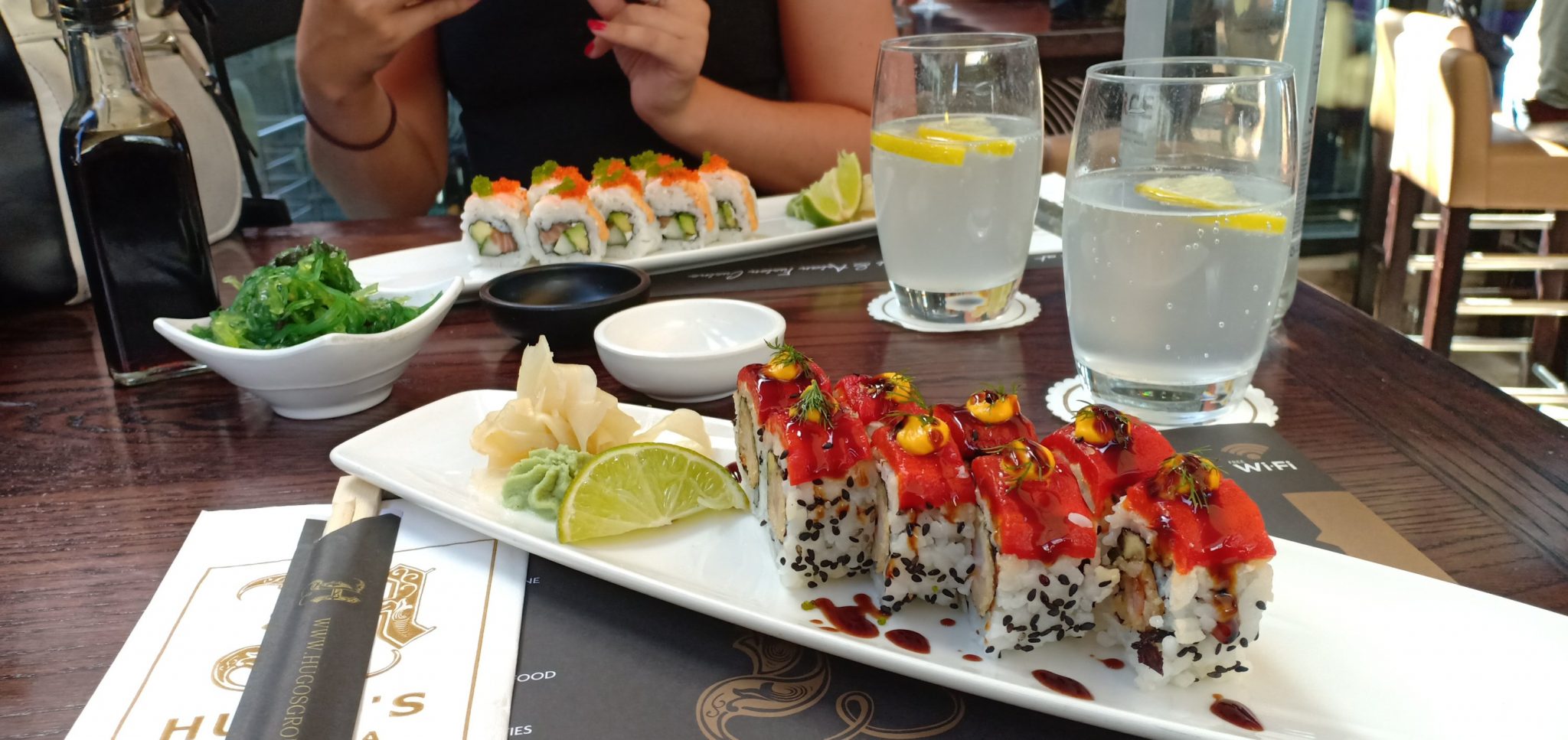 eating sushi at hugos lounge